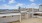 a rooftop with a city in the background