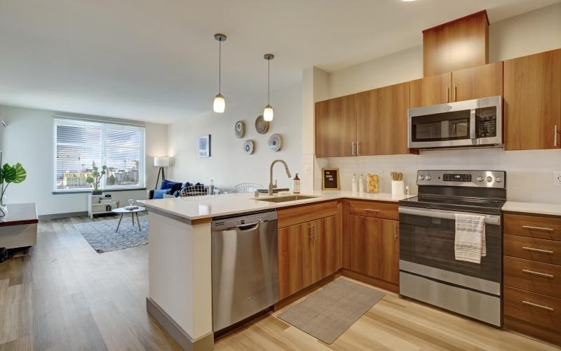 a kitchen with wooden cabinets
