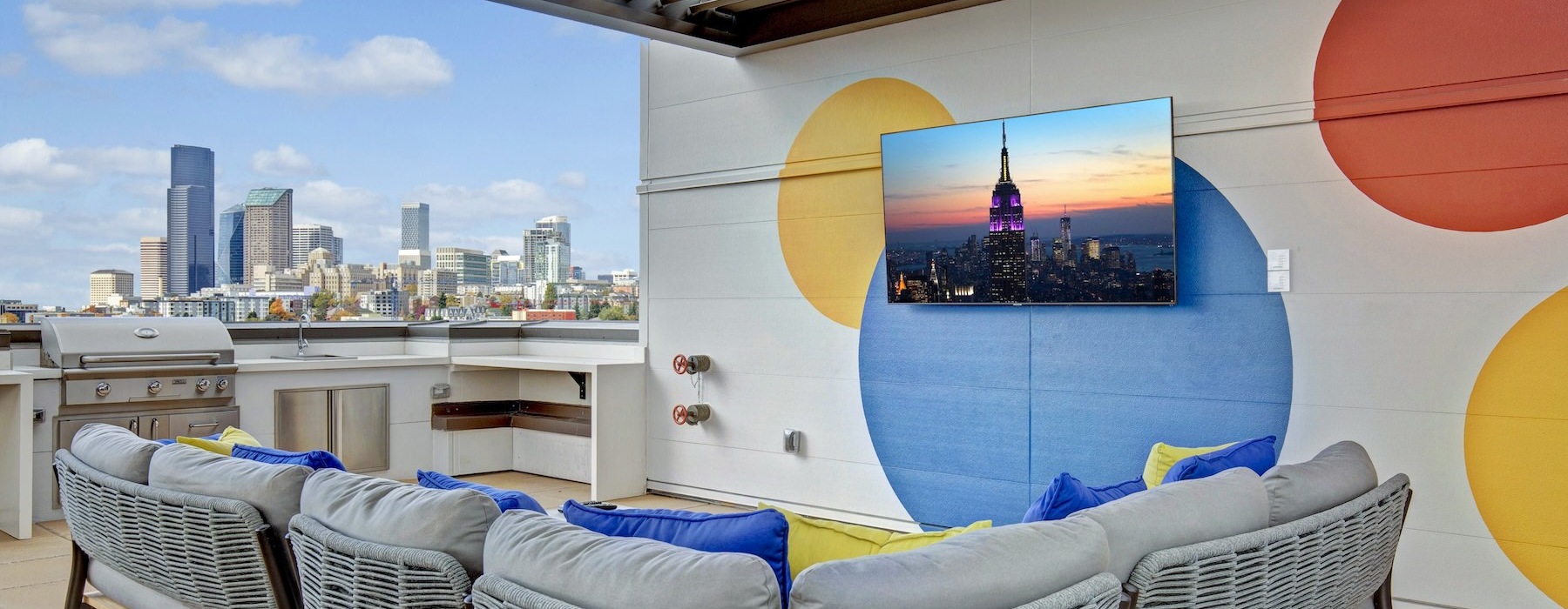a room with a tv and chairs