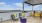 a deck with chairs and a table